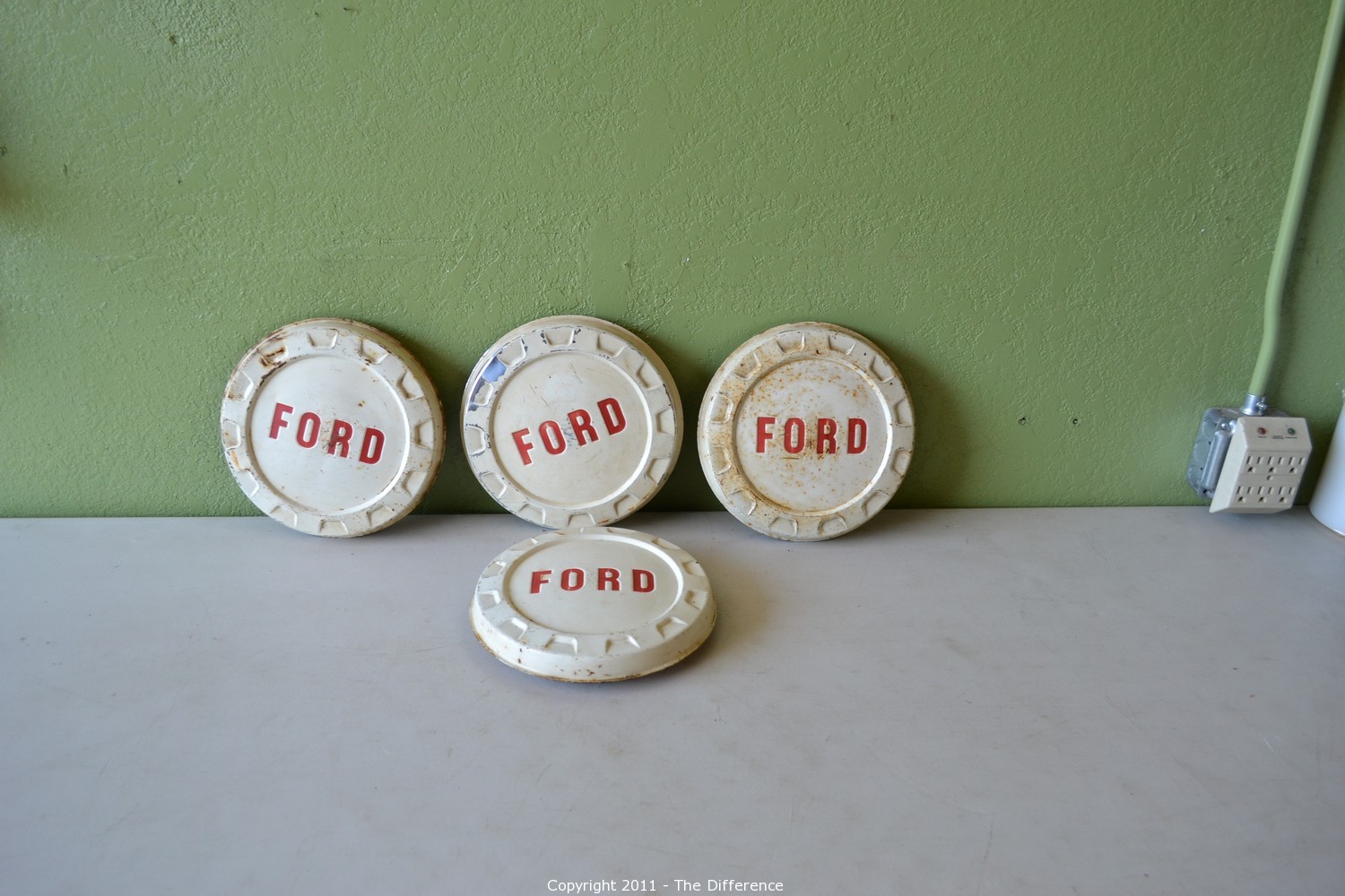 The Difference Auction Collectibles and More ITEM Vintage Ford Hub Caps