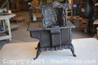 Cast Iron Stove-17 1/2 in x 10 1/2in x 21 1/2in-opening 6 1/2in x 4in