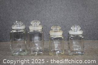 4 Clear Glass Canisters plus Lids